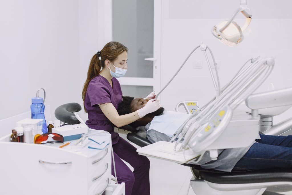 Dentist treating a patient at Smile Bright Westlands